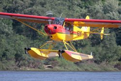 Aviat Husky A1C on Wipline 2100 Floats in Flight