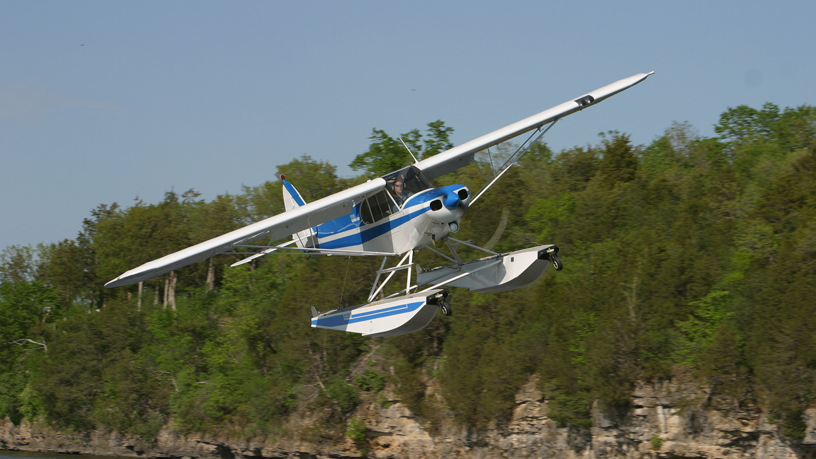 Piper Cub on Wipline 2100 Floats in Flight